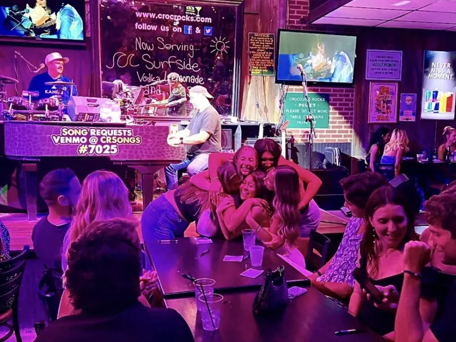 The dueling piano players mid-show with the crowd singing along